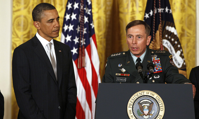 File photo of U.S. Army Gen. Petraeus and U.S. President Obama at event in the East Room of the White House