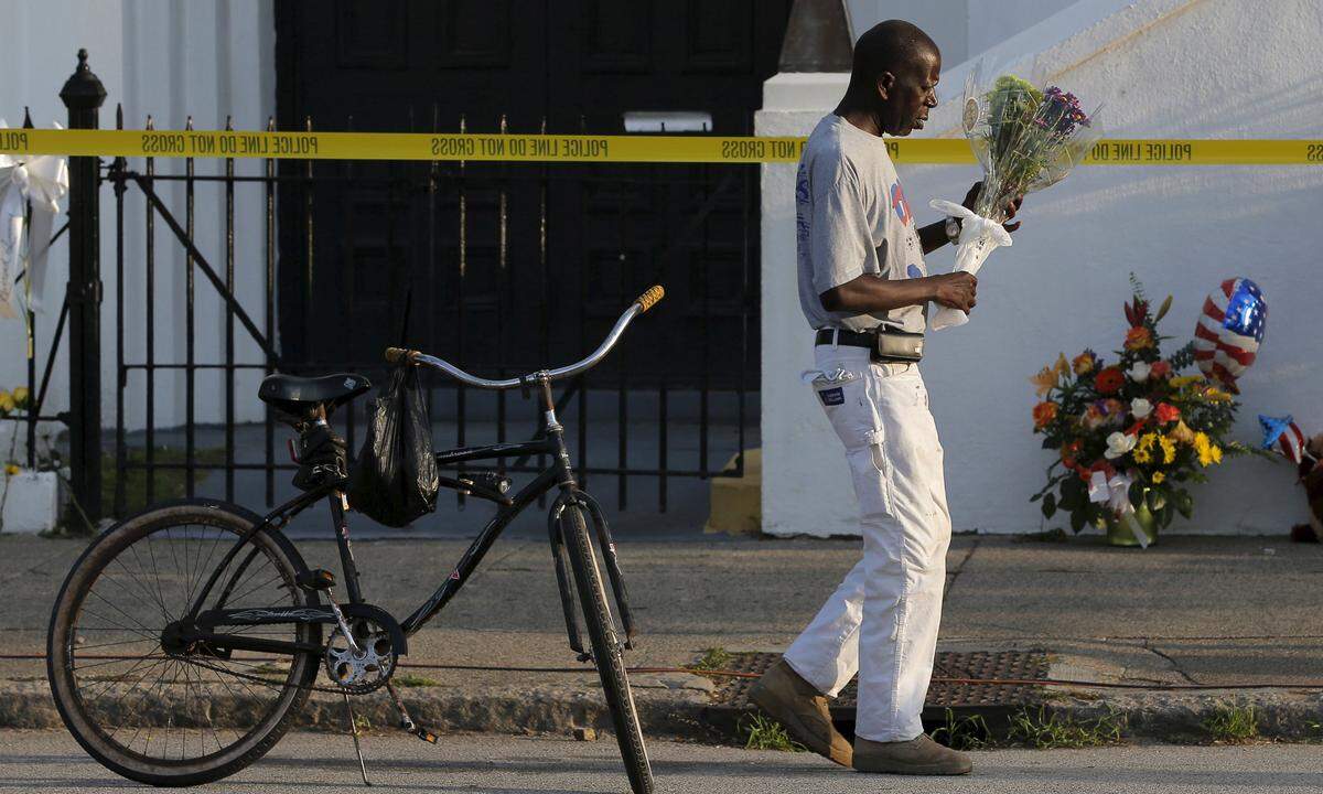 Gorham rode his bicycle to pay his respects outside the Emanuel African Methodist Episcopal Church in Charleston