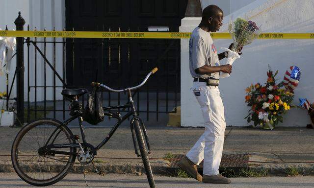 Gorham rode his bicycle to pay his respects outside the Emanuel African Methodist Episcopal Church in Charleston