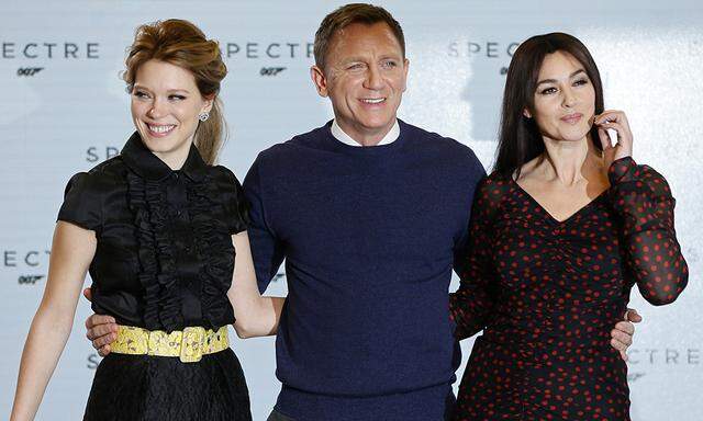 Actors Lea Seydoux, Daniel Craig and Monica Bellucci pose on stage during an event to mark the start of production for the new James Bond film ´Spectre´ at Pinewood Studios