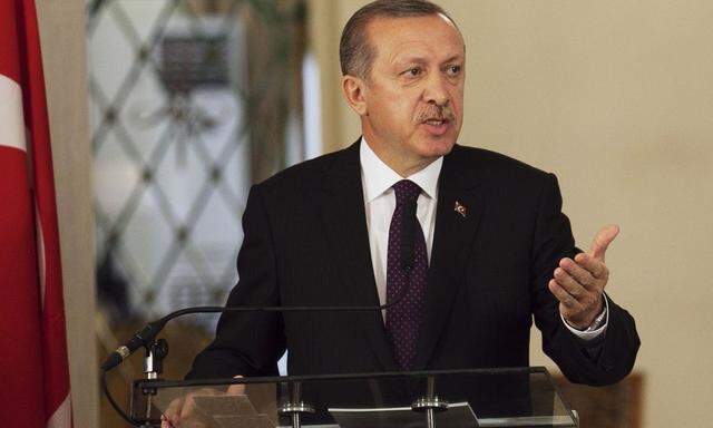 Turkey's Prime Minister Tayyip Erdogan speaks to the media during a meeting with Senegal's President Macky Sall at the presidential palace in Daka