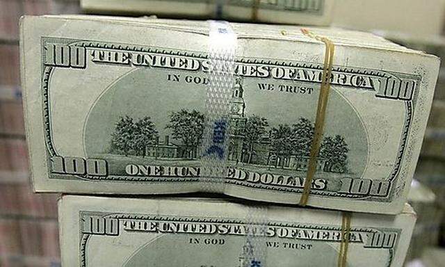 Hundred dollar bills are seen bundled after being counted at the headquarters of the Korea Exchange B