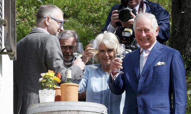 Britain´s Prince Charles and his wife Camilla, Duchess of Cornwall, visit a traditional wine tavern in Vienna