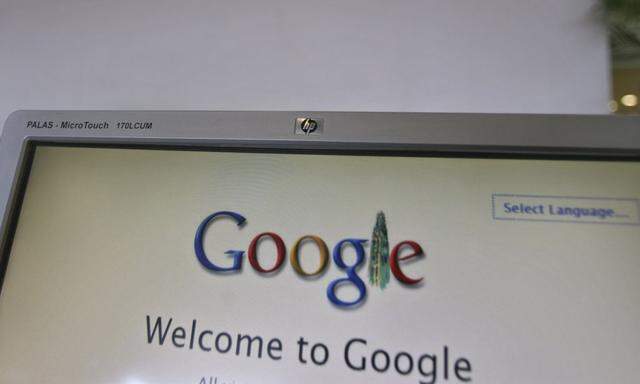 File photo of a security personnel answering a call at the reception counter of the Google office in the southern Indian city of Hyderabad