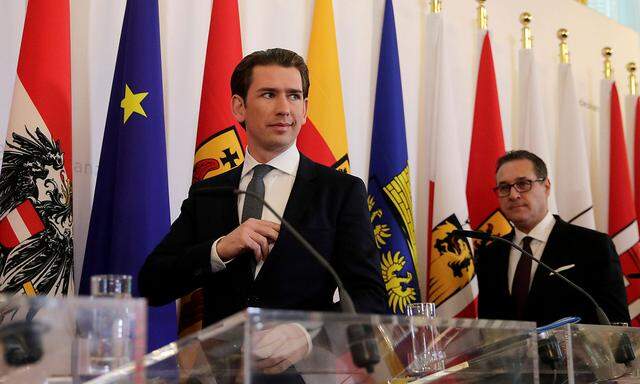 Austria's Chancellor Kurz and Vice Chancellor Strache arrive for a news conference after a cabinet meeting in Vienna