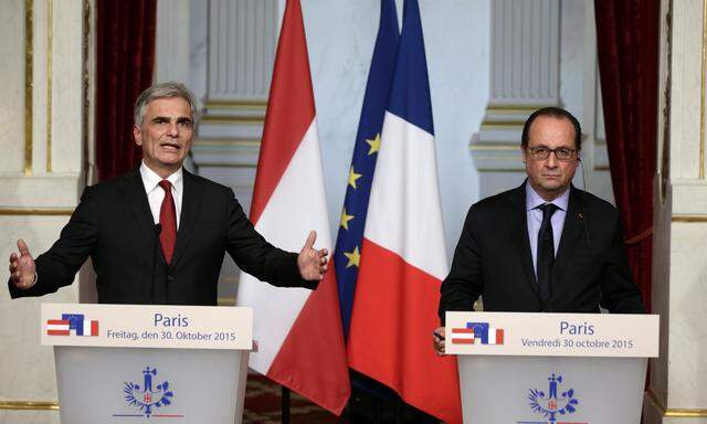 French President Francois Hollande and Austrian Chancellor Werner Faymann attend a bilateral statement at the Elysee Palace in Paris
