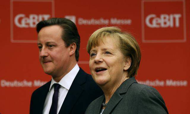 German Chancellor Merkel and British PM Cameron arrive for the opening ceremony of the Hanover technology fair Cebit