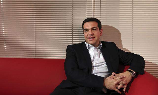 Greece´s PM Tsipras looks on during a meeting with Greek centrist party To Potami leader Theodorakis in Athens