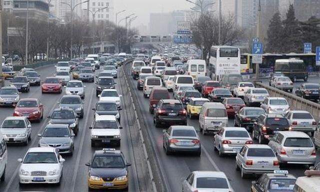 Cars travel on a main road in a traffic jam at the second ring road in Beijing