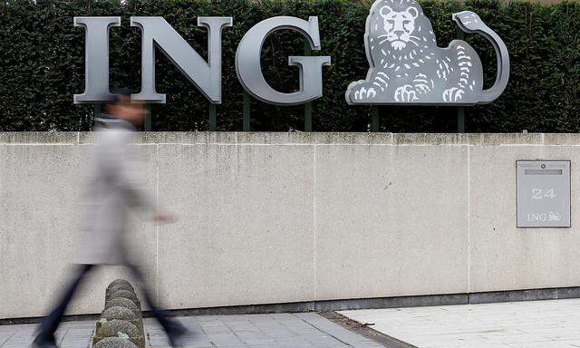 A pedestrian walks past the logo of ING bank by the group's main office in Brussels