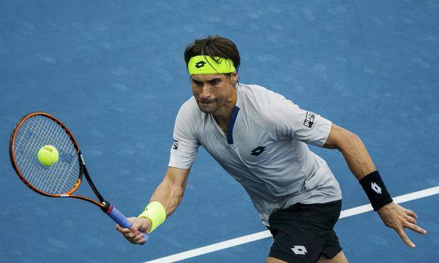 Ferrer of Spain hits a return to Albot of Moldova during their match at the U.S. Open Championships tennis tournament in New York,