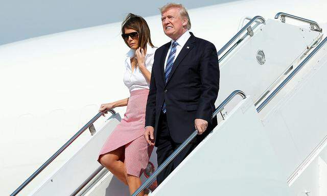 President Donald Trump and first lady Melania Trump arrive at Morristown municipal airport