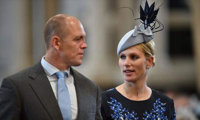 FILE PHOTO: Britain's Zara Phillips and her husband Mike Tindall arrive for a service of thanksgiving for Queen Elizabeth's 90th birthday at St Paul's cathedral in London