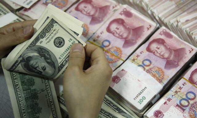 Die Bank für Internationalen Zahlungsausgleich warnt: Chinas Banken und Unternehmen haben zu viele Schulden in US-Dollar.