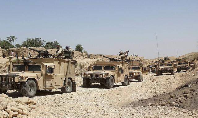 150727 FARYAB July 27 2015 Afghan soldiers patrol with their military vehicles during an o