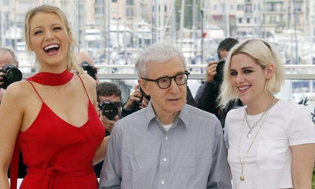 Actress Blake Lively jokes with director Woody Allen and actress Kristen Stewart as they pose during a photocall for the film 'Cafe Society' out of competition before the opening of the 69th Cannes Film Festival in Cannes