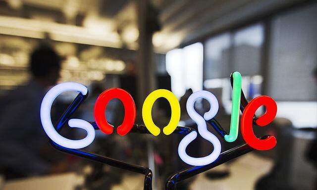 A neon Google logo is seen at the new Google office in Toronto