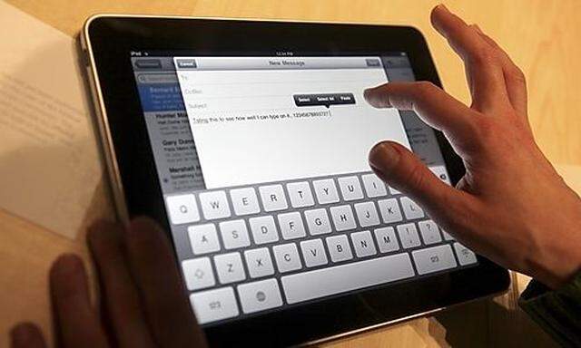 Typing is demonstrated on the new Apple  iPad during  the launch of the tablet computing device in 