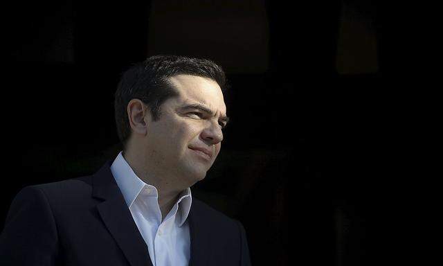 Greek PM Tsipras looks on before welcoming Palestinian President Mahmoud Abbas at the Maximos Mansion in Athens
