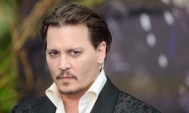 American actor Johnny Depp attends the premiere of Alice Through The Looking Glass at Odeon Leicest