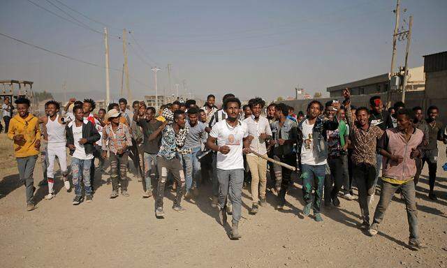 Supporters celebrate as they welcome Merera Gudina, leader of the Oromo Federalist Congress party after his release from prison in Addis Ababa