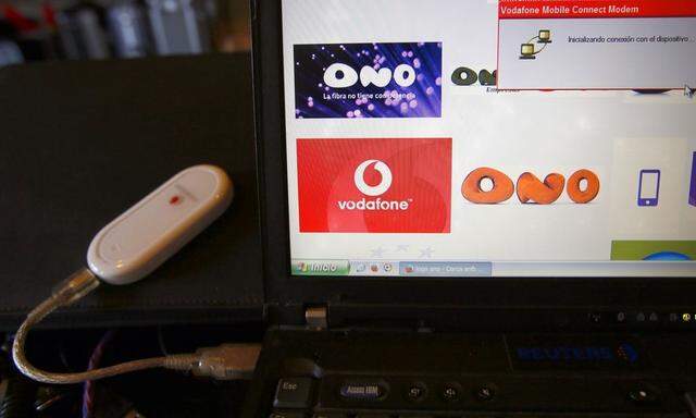 A Vodafone device connected to a laptop and an internet page with logo from Ono and Vodafone, is seen at an office in Barcelona
