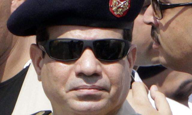 File photo of Army Chief General Abdel Fattah attending military funeral service of police General Farag in Cairo's Nasr City