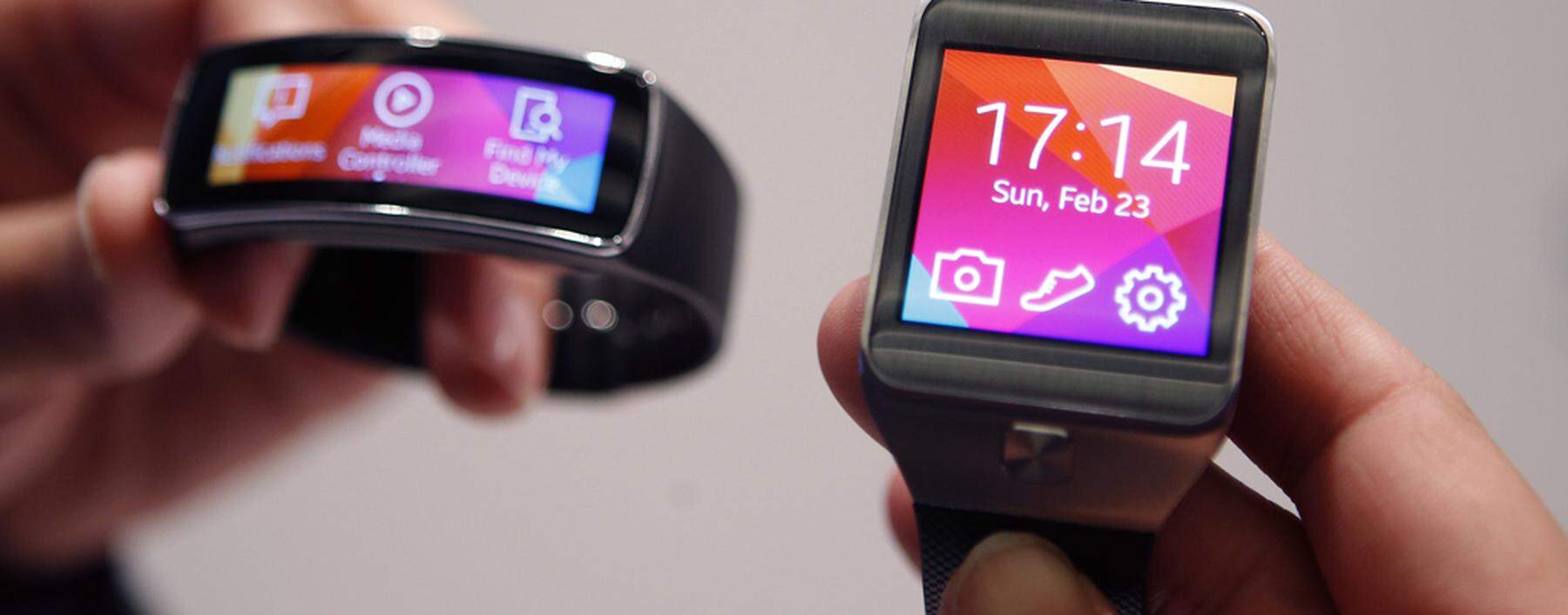New Samsung Gear 2 smartwatch and Gear Fit fitness band are displayed at the Mobile World Congress in Barcelona