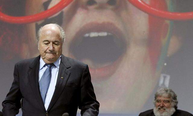 File photo of then FIFA President Blatter standing in front of then executive member Blazer the 61st FIFA congress in Zurich