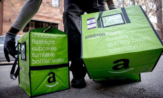 An Amazon worker delivers groceries 