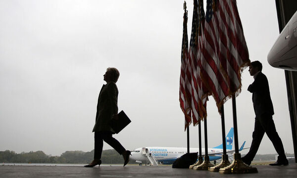 U.S. Democratic presidential candidate Hillary Clinton arrives to a press briefing before boarding her campaign plane at the Westchester County airport in White Plains