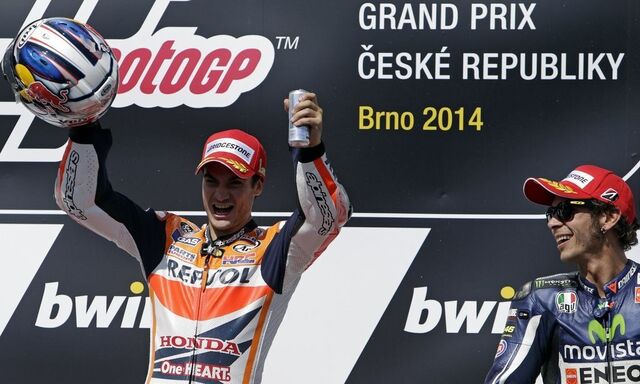 Winner Honda MotoGP rider Pedrosa of Spain celebrates next to third-placed Yamaha MotoGP rider Rossi of Italy after the Czech Grand Prix in Brno