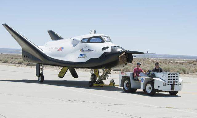 Sierra Nevada Corporation engineers and technicians prepare the firm´s Dream Chaser engineering test vehicle for tow tests on a taxiway at NASA´s Dryden Flight Research Center in Palmdale California