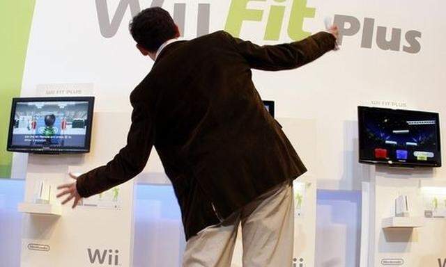 A man plays the Wii Fit Plus at the E3 Electronic Entertainment Expo in Los Angeles