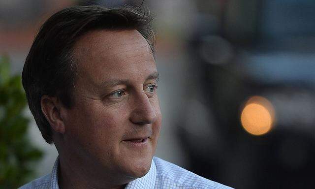 Britain's PM Cameron arrives at his hotel in Manchester, northern England