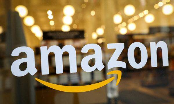FILE PHOTO: The logo of Amazon is seen on the door of an Amazon Books retail store in New York