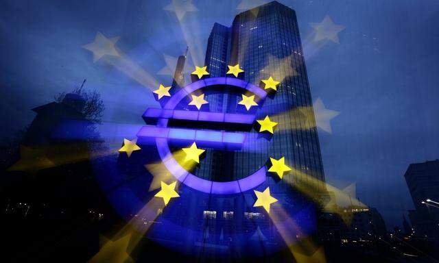 File zoom-burst image shows the illuminated euro sign in front of the headquarters of the European Central Bank in Frankfurt