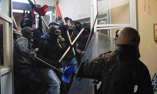 Riot police clash with masked youths occupying the Labour Center of Thessaloniki