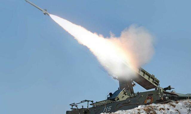 Rocket fired during drill of drones assaulting targets and a firing drill of flak rocket destroying cruise missiles in an undisclosed location in this KCNA picture, in Pyongyang