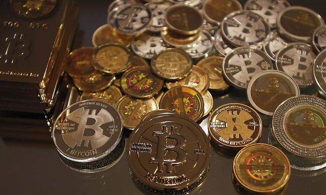 Some of Bitcoin enthusiast Mike Caldwell's coins are pictured at his office in Sandy, Utah