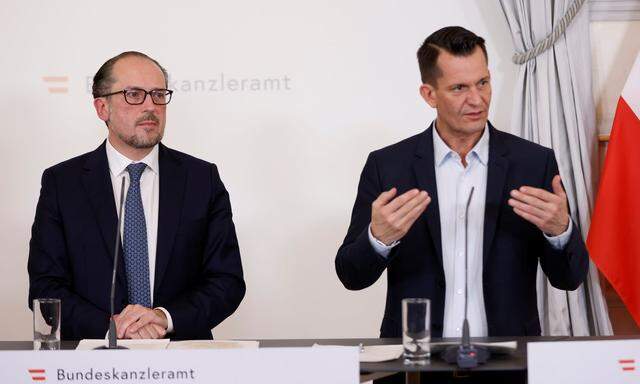 Austrian Chancellor Alexander Schallenberg and Health Minister Wolfgang Mueckstein attend a news conference in Vienna