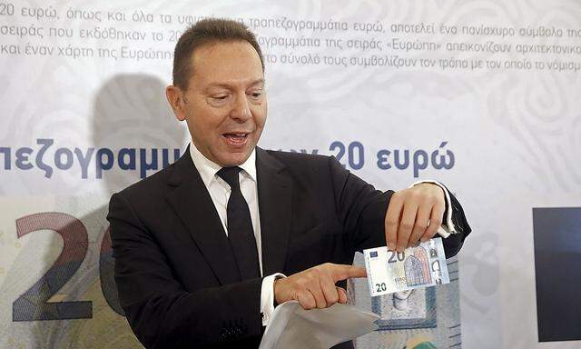 Governor of the Central Bank of Greece Stournaras presents the new 20 Euro banknote at the institution's Museum in Athens