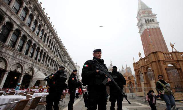 Italian Carabinieri officers patrol during the Venice Carnival at San Marco Piazza in Venice