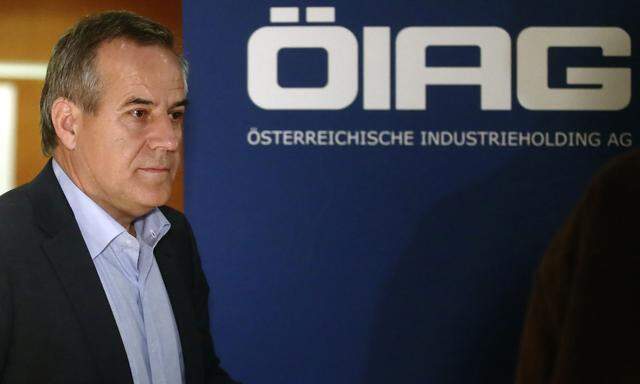 Siegfried Wolf, chairman of Austrian state holding OIAG, leaves a news conference in Vienna