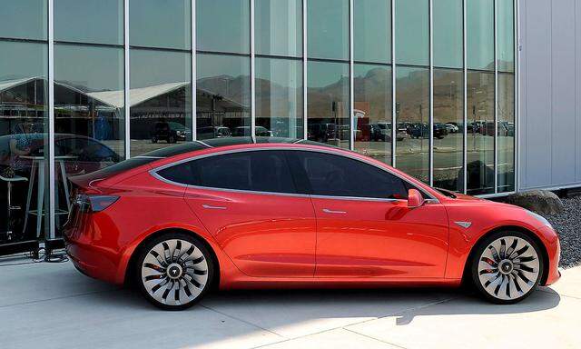 FILE PHOTO: A prototype of the Tesla Model 3 on display in front of the factory in Sparks