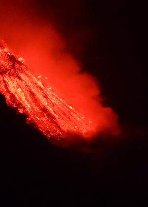 Lava flows into the sea, as seen from Tijarafe, following the eruption of a volcano on the Canary Island of La Palma