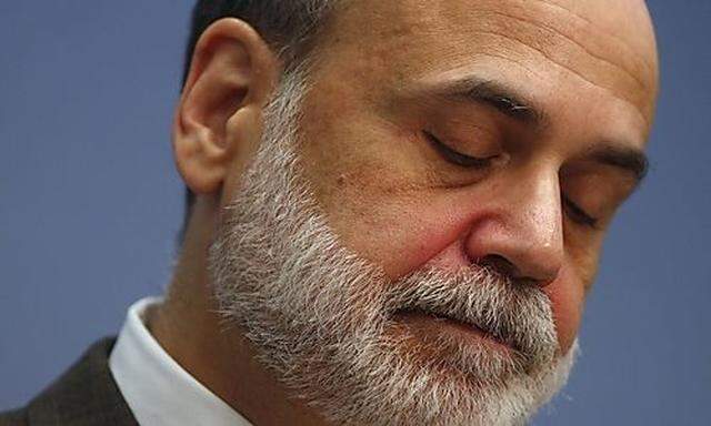 U.S. Chairman of the Federal Reserve Bernanke looks down while speaking at the Brookings Institution 