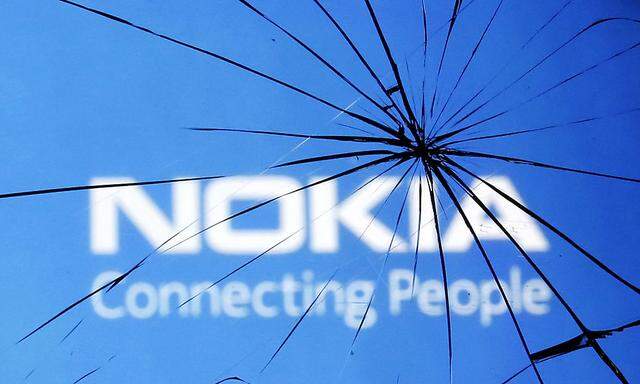 An illustration picture shows Nokia logo through a broken glass