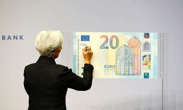 European Central Bank (ECB) President Lagarde gives a signature for newly printed euro banknotes in Frankfurt