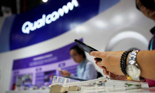 FILE PHOTO: A Qualcomm sign is seen during the China International Import Expo (CIIE), at the National Exhibition and Convention Center in Shanghai